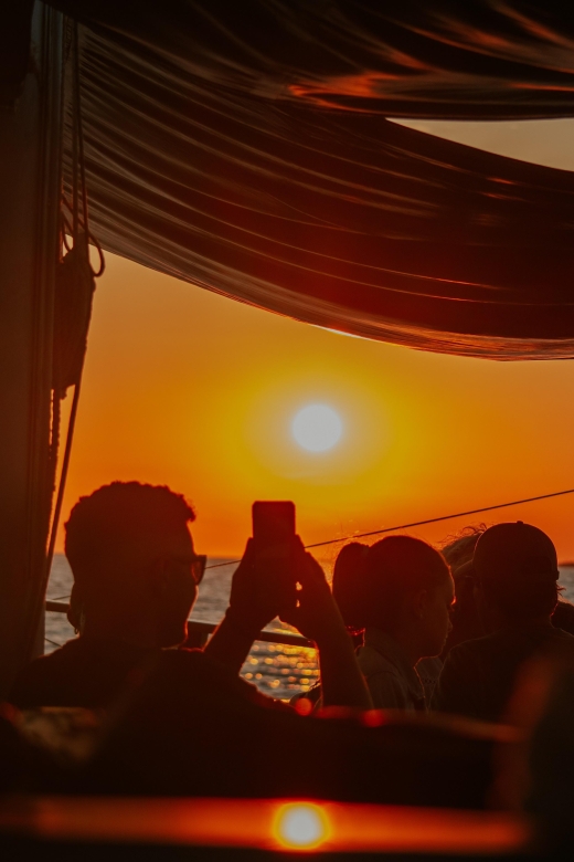 Argostoli: Sunset Cruise with Swim Stops, Dinner, and Wine - Meeting the Queen Bee at Argostoli Harbor