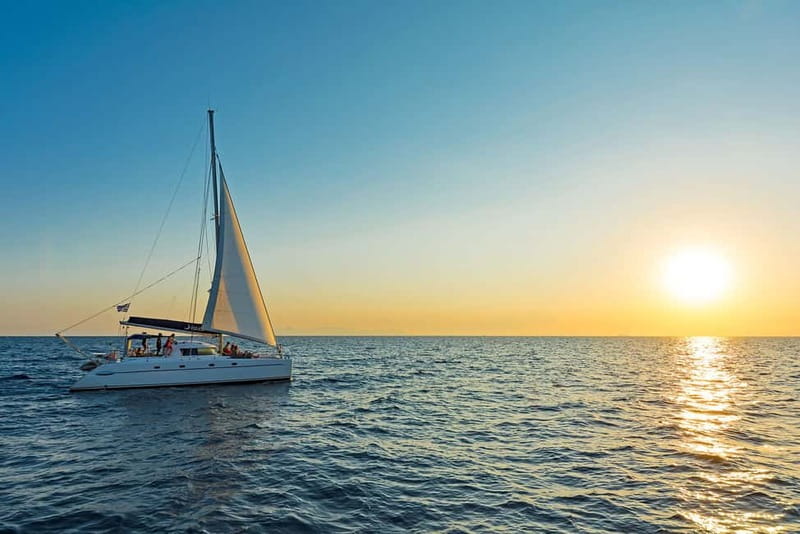 Athens: Half-Day Sunset Catamaran Cruise with Meal & Drinks - Swimming and snorkeling in the evening