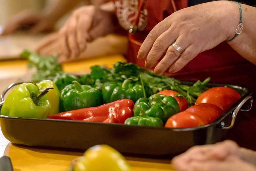 Athens: Kerameikos Stone House Cooking Class - Eating in the garden with local wine