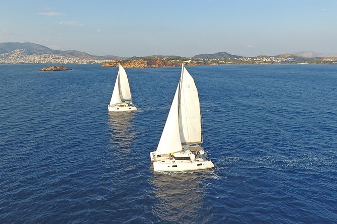 Athens Private Luxury Catamaran Cruise with Traditional Greek Meal and BBQ - Boarding with a welcome drink and safety briefing