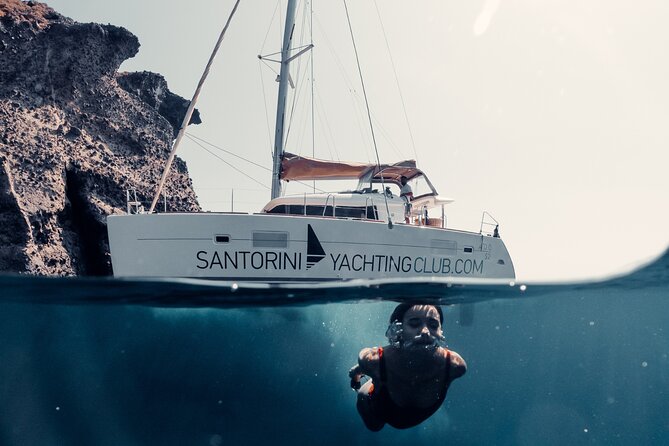 Beautiful Day Catamaran Caldera Cruise incl. Meal & Drinks - Setting sail from Ammoudi Bay