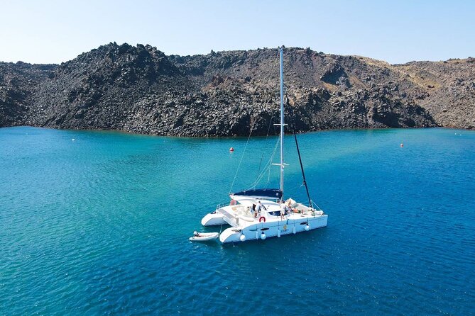 Best of Santorini Private Half-Day Catamaran Cruise with transfer and meal - Red Beach and the volcanic colors of Akrotiri