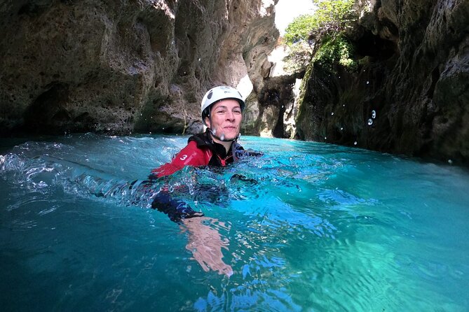 Canyoning in the water - Kourtaliotiko Gorge - Rappelling beside the waterfall