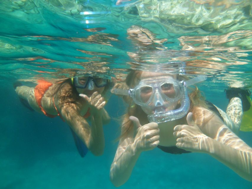 Chania: Boat Trip with Guided Snorkeling & Stand-Up Paddling - Snacks, photos, and time back on the boat
