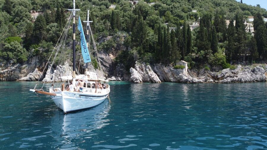 Corfu Town: Full-Day Cruise with Lunch, Drinks & Swim Stops - A Greek lunch with souvlaki and local wine
