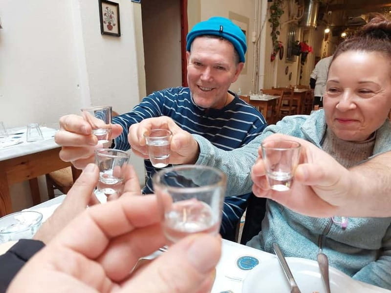 Eat Your Way Through Athens: A Local Food Walk - Tsipouro, cheese, sliced meats, olives, and olive oil