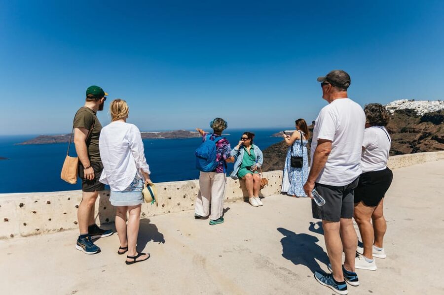 Fira: Guided Foodie Walking Tour with Tastings - Souvlaki, loukoumades, and Greek drinks