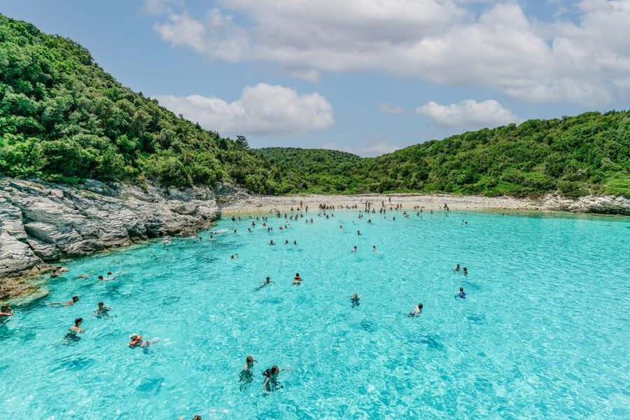 From Corfu Island: Antipaxos & Paxos Blue Caves Boat Cruise - The ride back: music, dancing, and a livelier mood