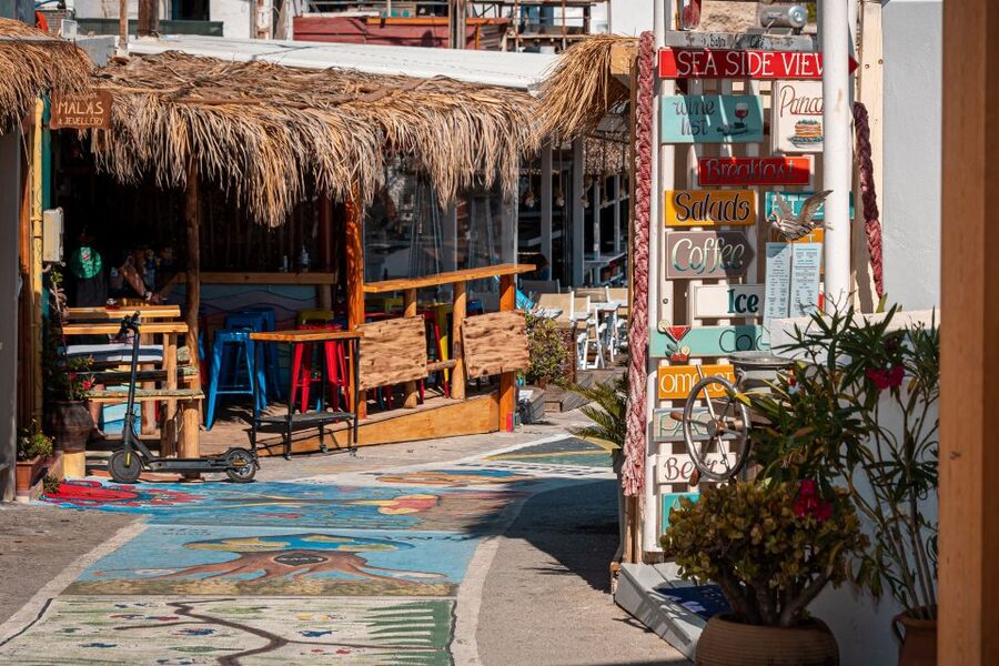 From Heraklion: Day Trip to Matala Hippie Beach and Caves - What the town adds to the beach day
