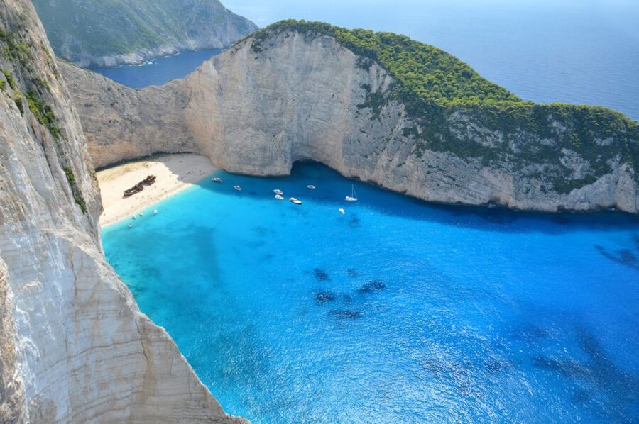 From Kefalonia: Blue Cave Boat Cruise & Shipwreck Photo Stop - Alykanas for lunch and a slower hour