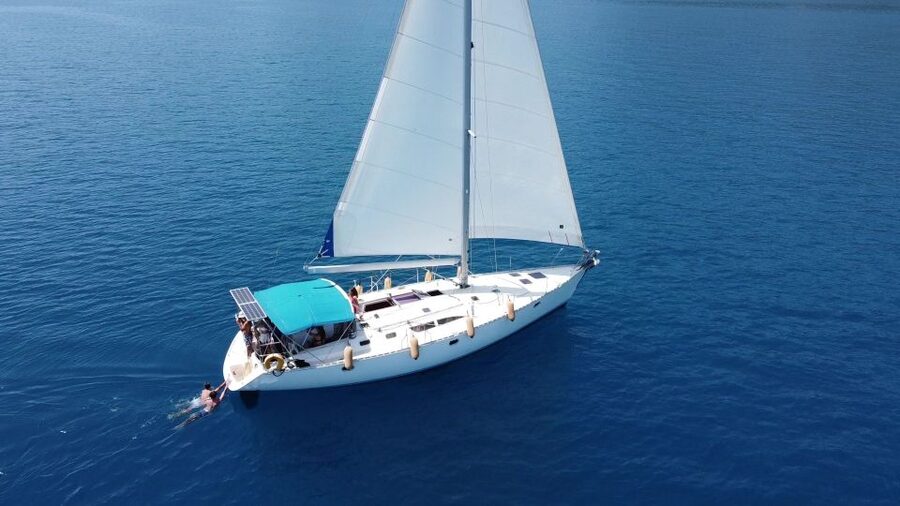 Gouvia: Corfu Island Sailing Trip with Snack and Soft Drinks - Gialiskari combines swimming, snorkeling, and cliff jumping