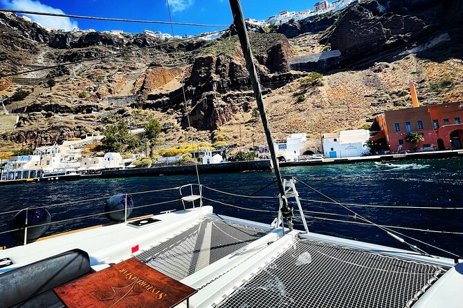 Half Day Premium Catamaran Cruise in Santorini including Oia - The Venetian lighthouse and the sunset finale