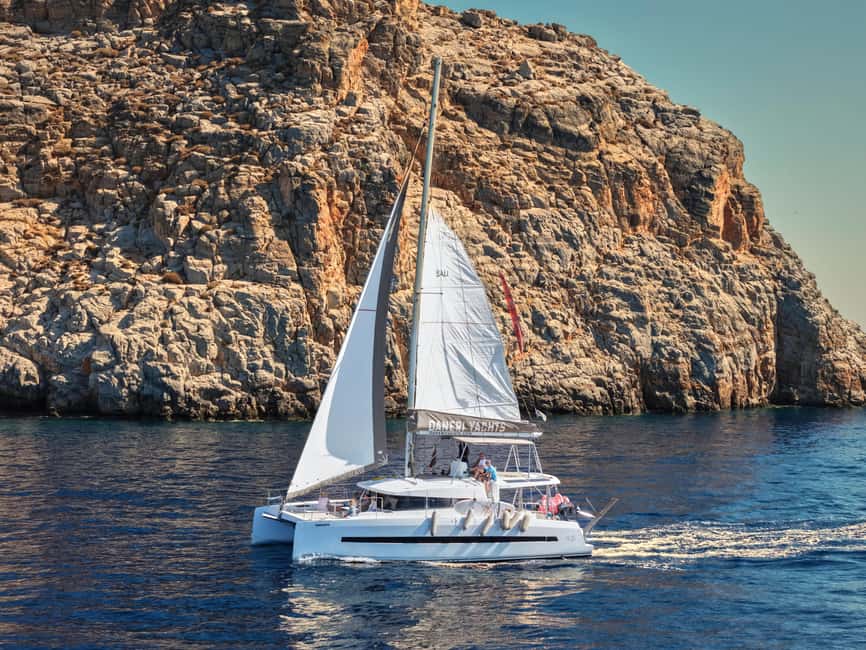 Hersonissos: Catamaran Sailing Trip to Dia Island with Lunch - Leaving Hersonissos Port on a spacious catamaran
