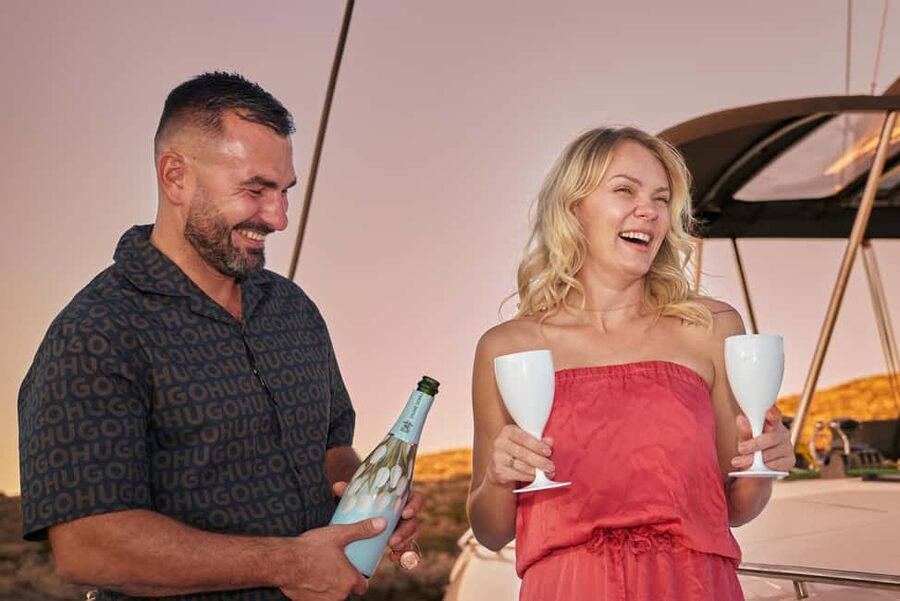 Hersonissos: Sunset Catamaran Cruise with Snacks and Drinks - Setting sail from Hersonissos Port