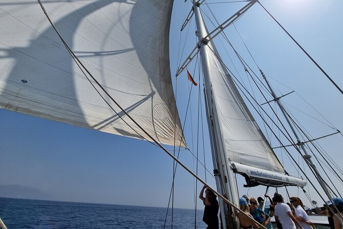 Mykonos Sail Cruise to Rhenia, Guided Tour of Delos, Lunch&Drinks - Pasta, Greek salad, and drinks on deck
