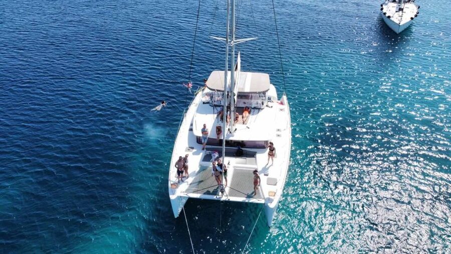 Naxos: Naxos Catamaran Sailing Cruise with Lunch and Drinks - Sunbathing, seating, and life aboard the catamaran