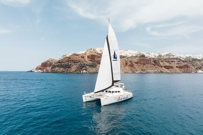 Private Morning Tour Lagoon 400-380 Sailing in Santorini ,lunch, drink, transfer - Coastal views from Aspronissi to Black Mountain