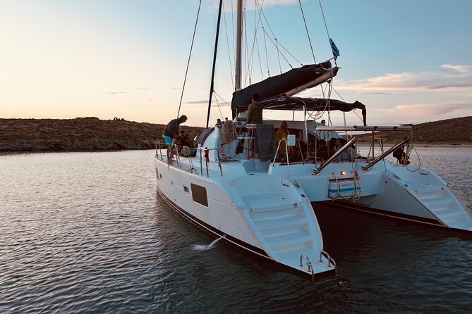 Private Mykonos Catamaran Day Cruise with Meals & Water Toys - Rineia: Quiet Water and Swimming Time