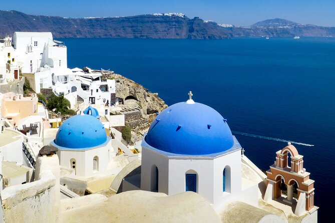 Private Overview of Santorini: Full-Day Customizable Experience! - Oia: blue domes, cliff paths, and a famous sunset