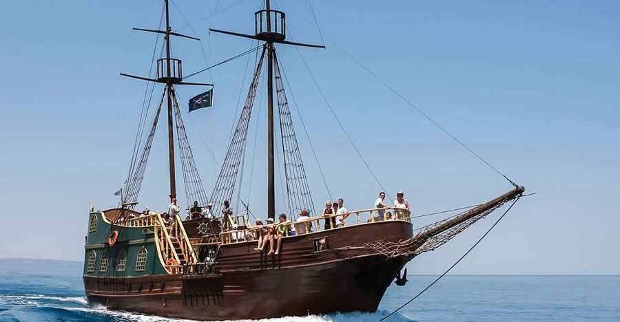 Rethymno: Sunset Cruise on a Wooden Pirate Boat - Sunset beyond the harbor