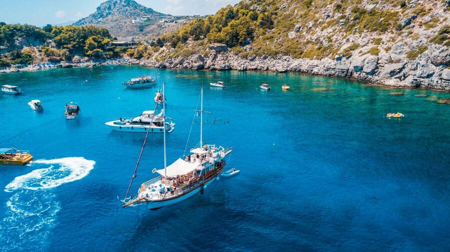 Rhodes: Cruise with 3 Stops, Lunch and Unlimited Drinks - Kallithea Springs: clear water, rocks, and ladders