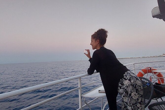 Rhodes Sunset Cruise - Swim and Dine w/ Live Music & Sunset! - Watching the sunset from open water