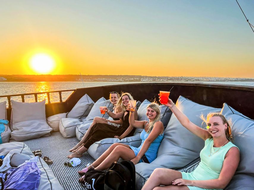 Rhodes: Sunset Cruise with Greek BBQ and Unlimited Drinks - Sunset over the western horizon