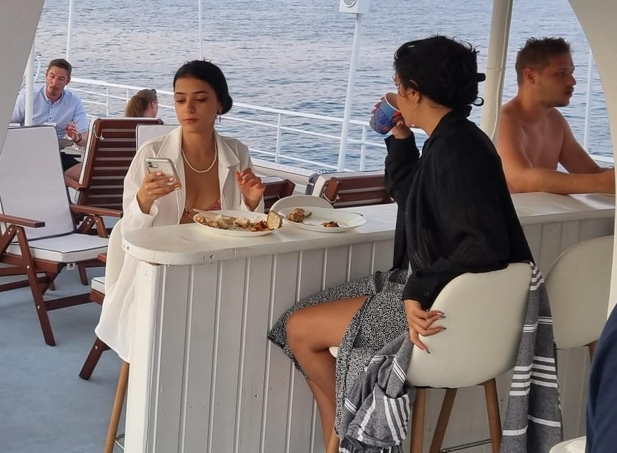 Rhodes: Sunset Cruise with Live Music, Wine & Greek Buffet - Meeting the Romantika Dreams in Mandraki Port