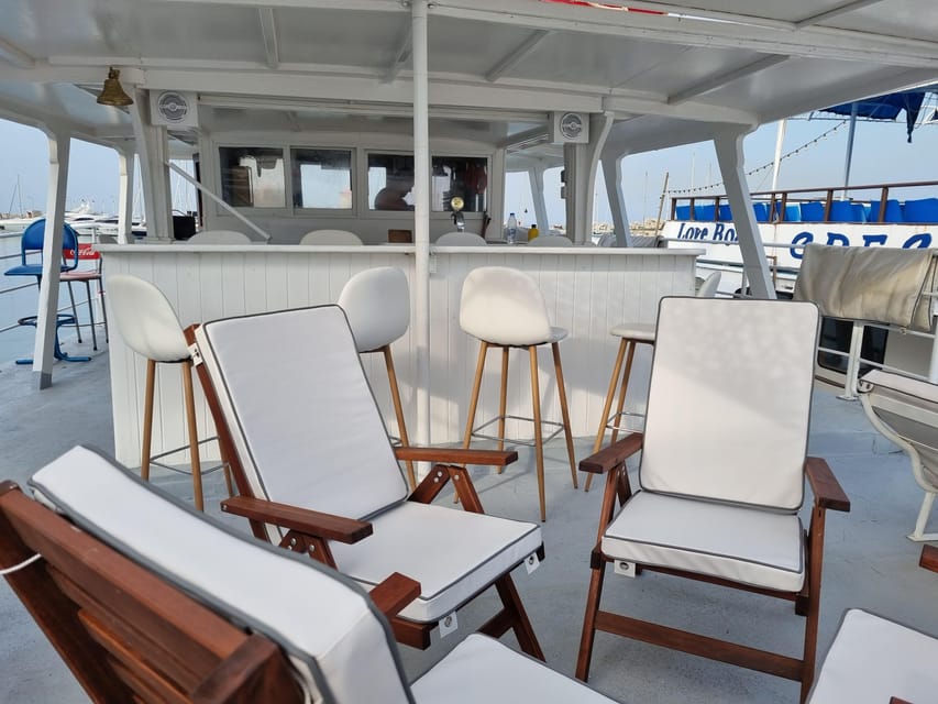 Rhodes: Sunset Cruise with Live Music, Wine & Greek Buffet - Kallithea Springs and the last swim of the day