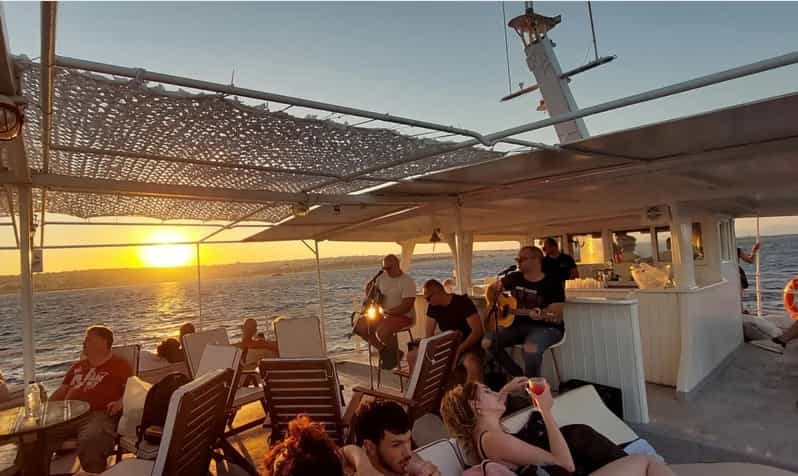 Rhodes: Sunset Cruise with Live Music, Wine & Greek Buffet - Live music on the return to Mandraki