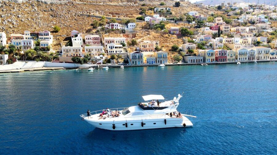 Rhodes: Symi Yacht Tour with Unlimited Drinks and Transfer - Arriving at Symi Yalos