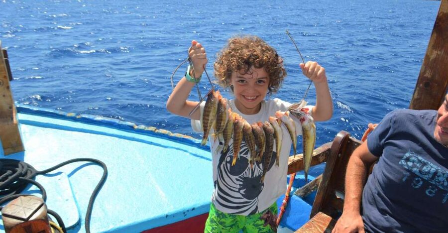 Rhodes Town: Fishing Boat Trip with Fish Meal and Swim Stops - Fishing lessons for beginners and families