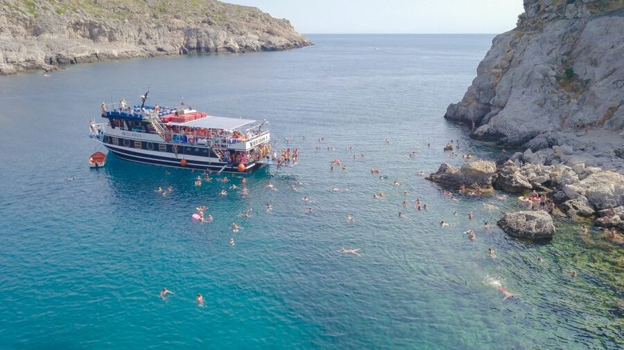 Rhodes Town: Scenic Cruise to Lindos with Swim Stops - Morning Pickup and the Route to Mandraki Port