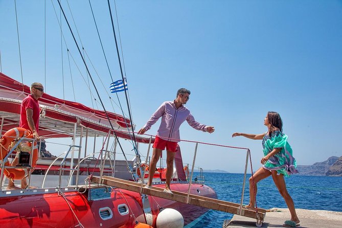 Sailing Catamaran Cruise in Santorini with BBQ, Drinks and Transfer - What the catamaran is like during the sail