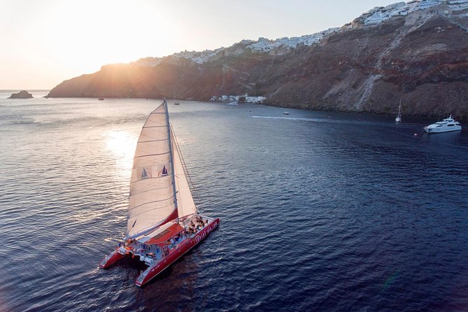 Sailing Catamaran Cruise in Santorini with BBQ, Drinks and Transfer - The crew and level of commentary