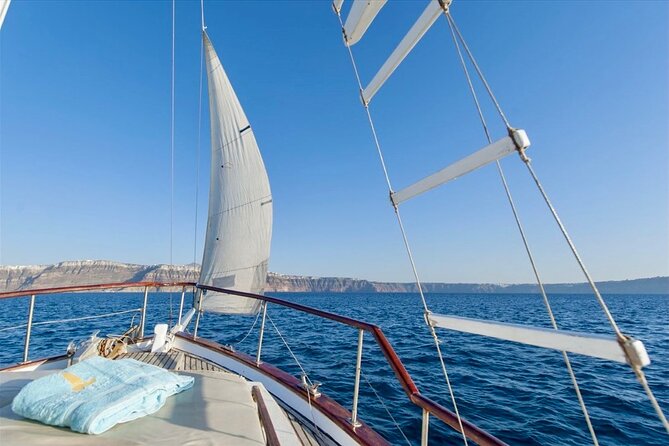 Santorini Caldera Day Traditional Cruise with Meal and Drinks - Arriving at Ammoudi Bay below Oia