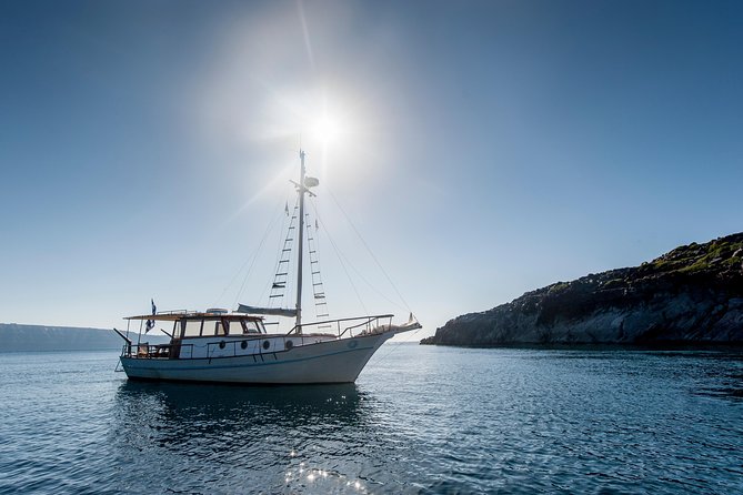 Santorini Caldera Day Traditional Cruise with Meal and Drinks - Red Beach: dramatic color, limited time