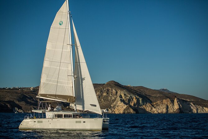 Santorini Caldera Gold Day Cruise with BBQ on board and Open Bar - Red Beach: Santorini’s most dramatic shore