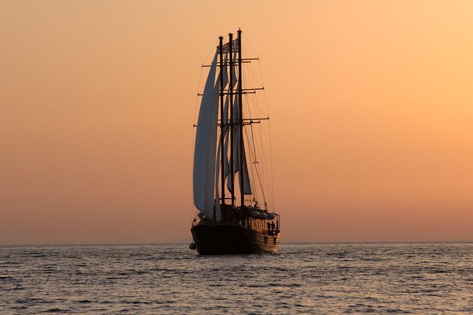Santorini Caldera Sunset Sailing Cruise with Dinner and Wine - Swimming toward Palea Kameni’s hot springs