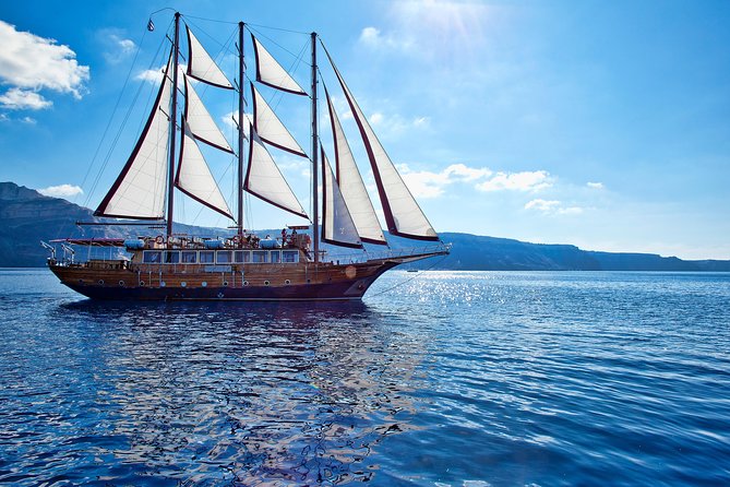 Santorini Caldera Sunset Sailing Cruise with Dinner and Wine - Sunset near Oia from the water