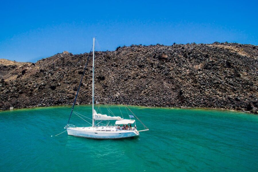 Santorini Caldera: Sunset Sailing Cruise with Meal - The Lighthouse, Indian Rock, and the Caldera