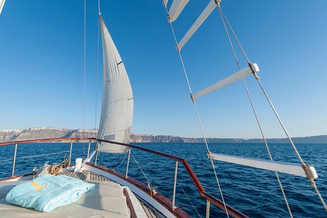 Santorini Caldera Sunset Traditional Cruise with Meal and Drinks - Black Mountain, Indian Rock, and the Akrotiri lighthouse