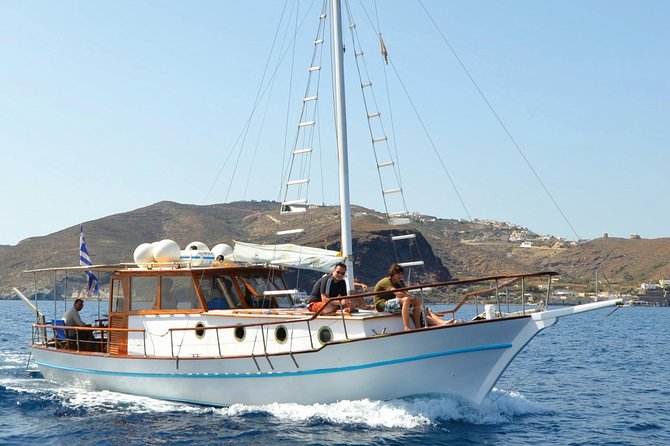 Santorini Caldera Sunset Traditional Cruise with Meal and Drinks - White Beach and Red Beach from the water
