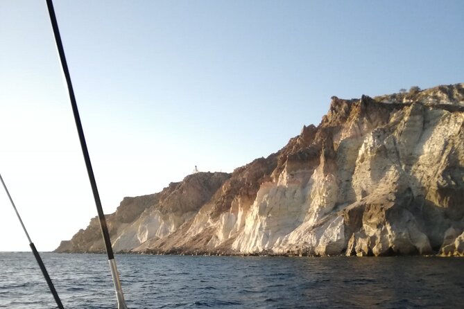 Santorini Catamaran Cruise with Fresh Meal and Open Bar - White Beach, the Akrotiri lighthouse, and Mesa Pigadia