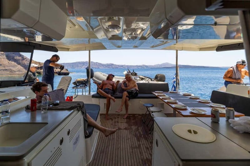 Santorini: Catamaran Cruise with Fresh Meal & Open Bar - Open bar, deck space, and the social atmosphere