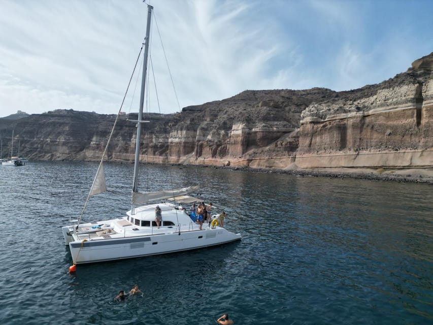 Santorini: Catamaran Cruise with Greek BBQ and Drinks - Sailing into the caldera and the Palea Kameni hot springs