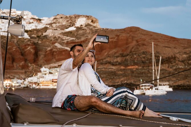 Santorini Catamaran Cruise with Greek Meal, Open-Bar and Sunset - Red Beach and the southern coast