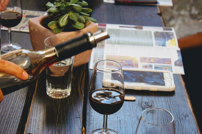 Santorini Family Farm Food & Wine Tour with Cooking Class - Learning Santorini wine in volcanic country
