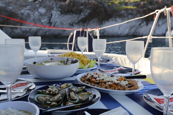 Santorini Half Day Catamaran Private Cruise incl. Meal, Drinks & Free Transport - Aspronisi, the white island outside the caldera