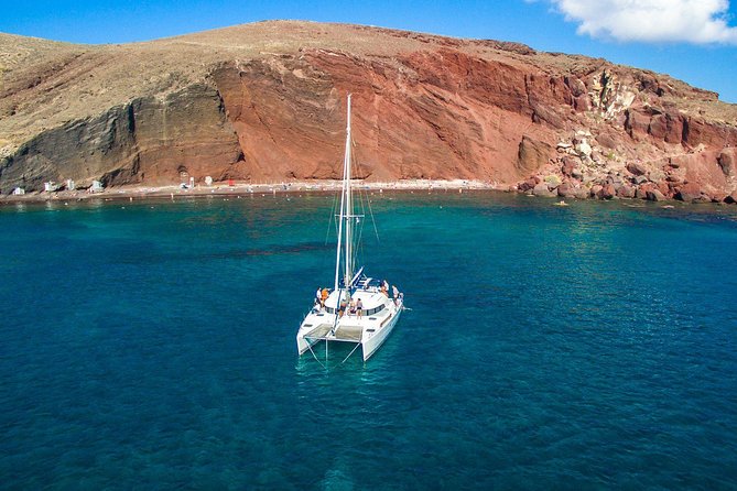 Santorini Half Day Catamaran Private Cruise incl. Meal, Drinks & Free Transport - Vlychada port and the first look at volcanic Santorini